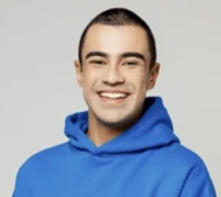 Happy Latin man, aged 20-30, wearing a blue hoodie and sporting short hair, set against a gray background